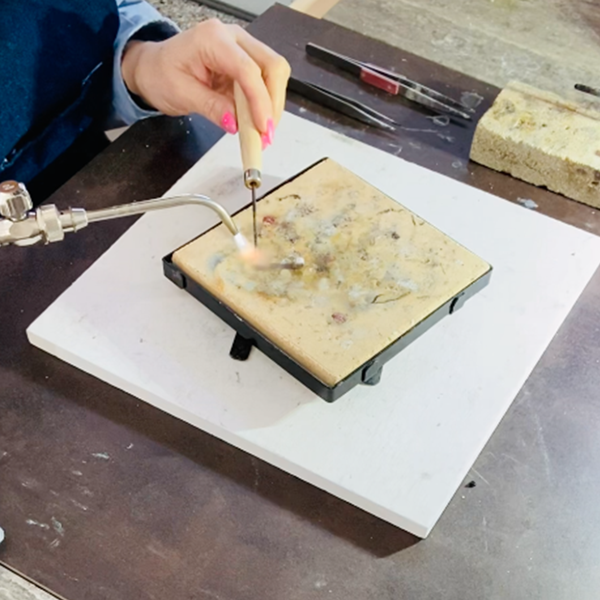 Lisa Ramos soldering jewelry in the MONOLISA studio