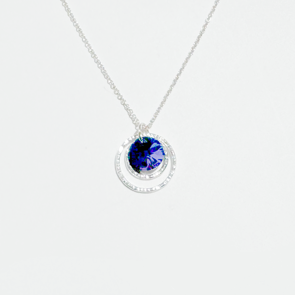 A Argentium silver purple crystal pendant necklace on a chain, displayed against a white background.