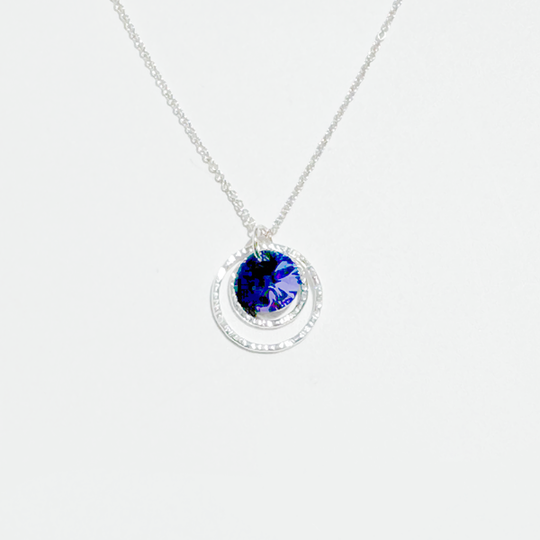 A Argentium silver purple crystal pendant necklace on a chain, displayed against a white background.