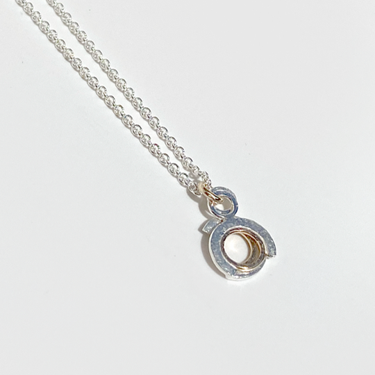 View of it Closed Together: Argentium® Silver and 14 Karat Gold Textured Pendant Necklace - Duo Movement | Handmade by Artist Lisa Ramos