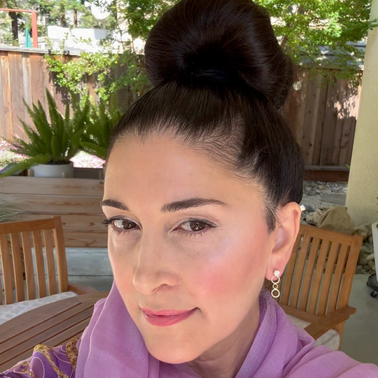 Artist Lisa Ramos Modeling the 14k Gold Earring Jackets with White Sapphire Studs. 